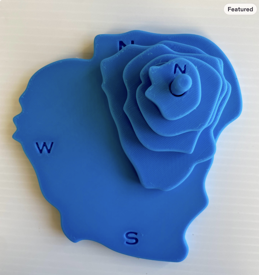 Blue layered topographic map with compass directions